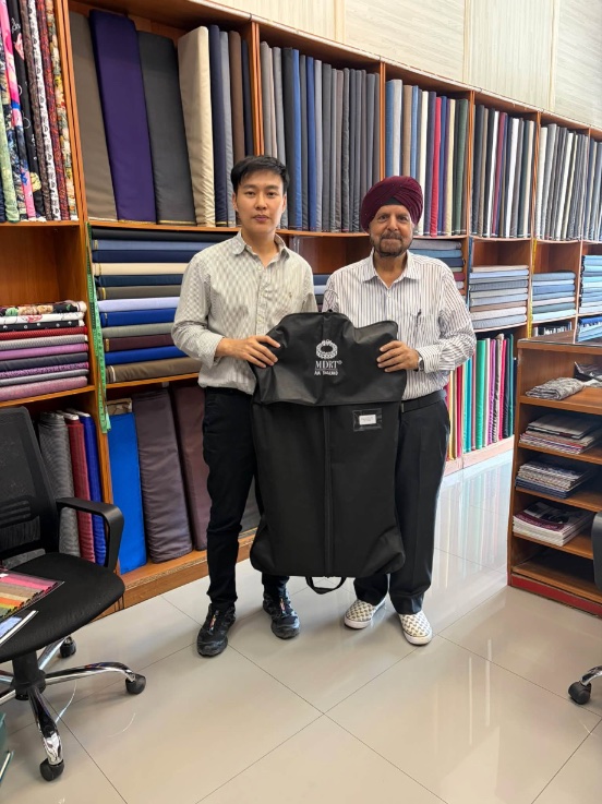 A customer collecting his suit