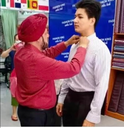 Frank fitting a shirt collar